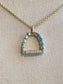 “Stirr It Up” Diamond and Blue Topaz Pendant